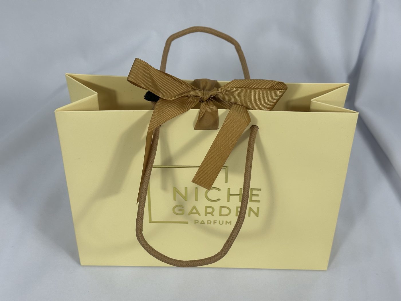 Chic Cream Ribbon Handle Gift Bag with Bow | Paper Bag J002 | HJLUXEPACK custom and luxury packaging provider View 1