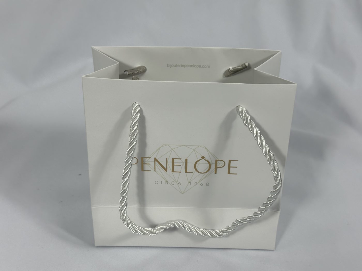 Sleek White Twisted Rope Handle Gift Bag | Paper Bag J005 | HJLUXEPACK custom and luxury packaging provider View 1