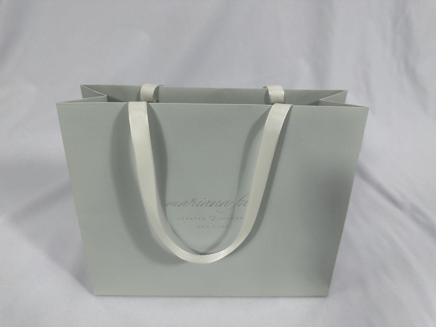 Sophisticated Light Grey Ribbon Handle Gift Bag | Paper Bag J007 | HJLUXEPACK custom and luxury packaging provider View 1