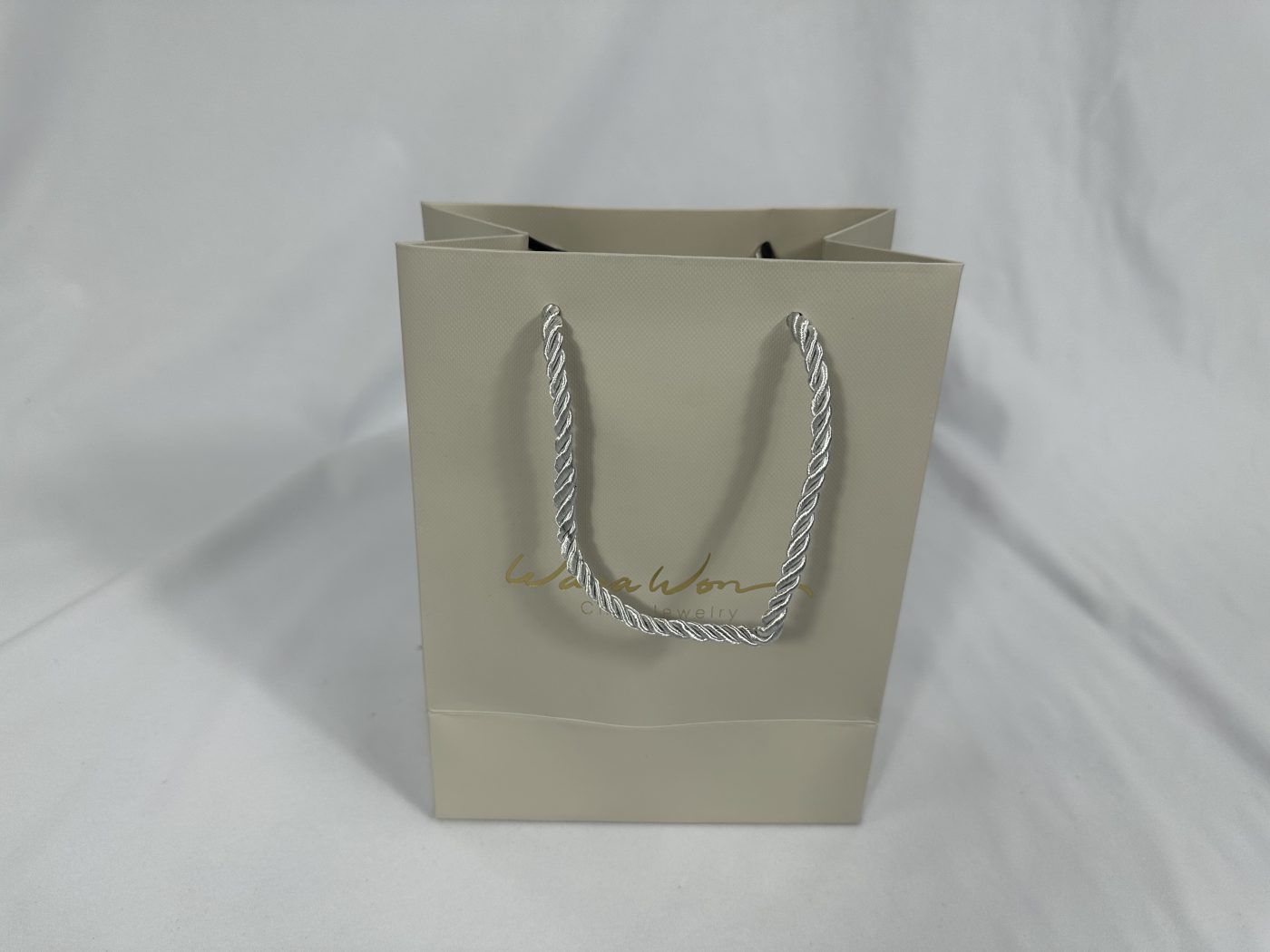 Classic Beige Twisted Rope Handle Gift Bag | Paper Bag J008 | HJLUXEPACK custom and luxury packaging provider View 1